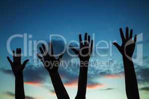 Four raised hands