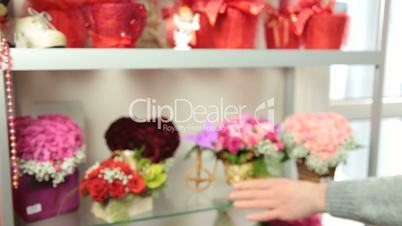 Florist Serving Customer in Flower Shop