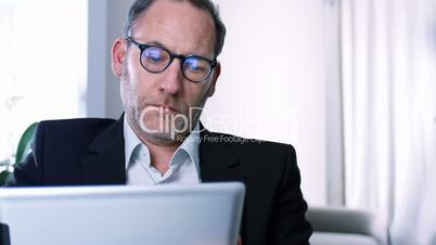 Businessman works with ipad - reflections