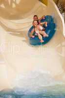 boy and girl  on water slide