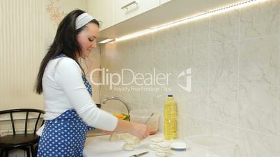 Woman Cooking Ingredients For Chebureks In The Kitchen