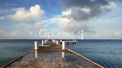 Morning pier stretching into the horizon of the Caribbean