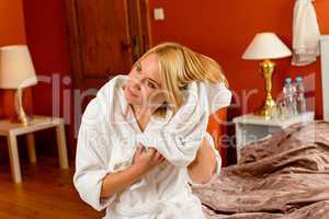 Happy woman bed room drying hair towel