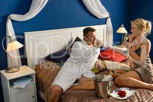 Romantic hotel room young couple sexy nightgown