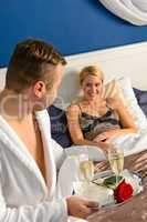 Husband flirting wife bedroom romantic evening celebration