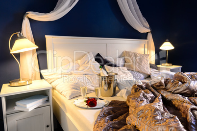 Rumpled sheets hotel bedroom romantic night