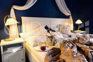 Rumpled sheets hotel bedroom romantic night
