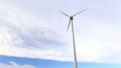 Wind turbine over the blue sky.
