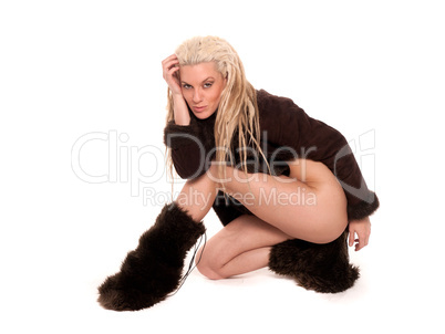 Beautiful girl with urban look  and dreadlocks dressed in furs