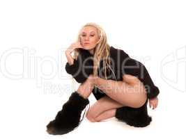 Beautiful girl with urban look  and dreadlocks dressed in furs