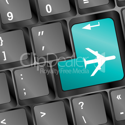 Online tickets key on the keyboard with airplane