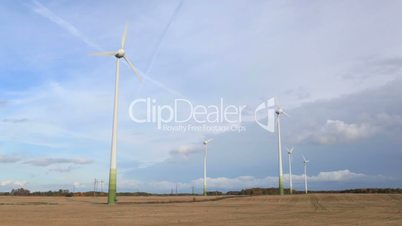 Wind turbines in the field. Time lapse.