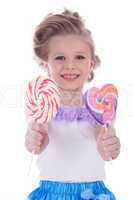 Little girl offer two lollipops