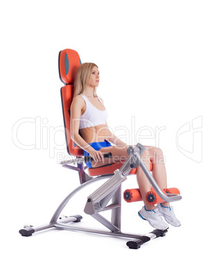 Blonde young woman on exerciser
