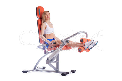 Blonde young woman on orange exerciser