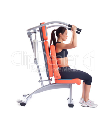 Brunette young woman on isodynamic exerciser