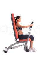 Brunette young woman on hydraulic exerciser