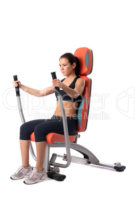 Brunette woman on hydraulic exerciser