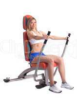 Blonde young woman on hydraulic exerciser