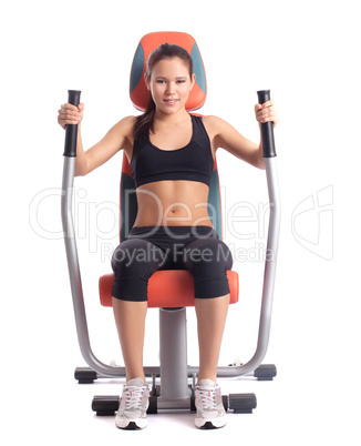 Brunette woman on orange  hydraulic exerciser