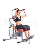 Young woman on orange  hydraulic exerciser