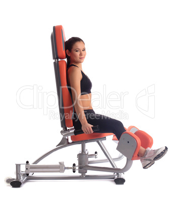 Young woman on hydraulic exerciser