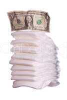 stack of diaper with dollar note