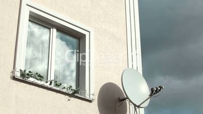 Home Exterior With Window Frame And Satellite Television Dish