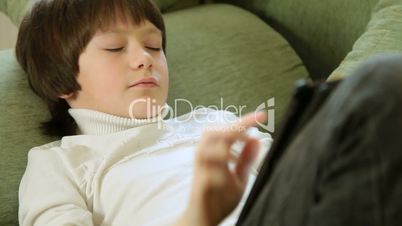 Child Using a Touch Screen Tablet PC