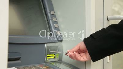 Businesswoman Getting Money At ATM