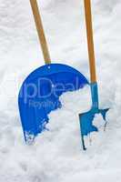Two Shovels In The Snow Heap