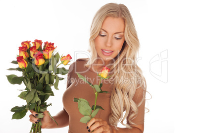 Beautiful woman with a bouquet of roses