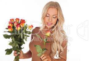 Beautiful woman with a bouquet of roses