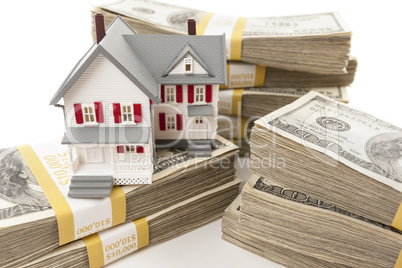 Stacks of Hundreds of Dollars with Small House