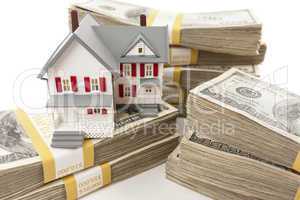 Stacks of Hundreds of Dollars with Small House