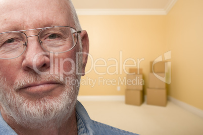 Sad Older Man In Empty Room with Boxes