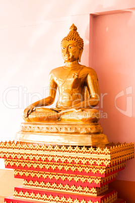 Sitting bronze buddha image statue at side