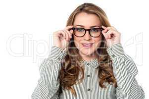 Smiling woman adjusting her spectacles