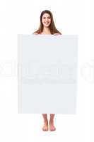 Naked woman hiding behind white ad board