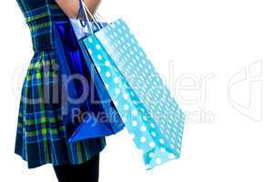 Trendy girl with shopping bags, cropped image