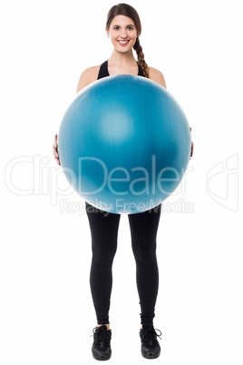 Gym girl presenting a swiss ball