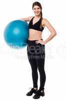 Fitness woman with big blue exercise ball