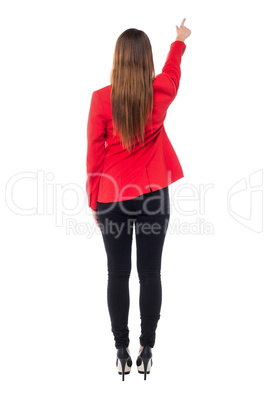 Woman pointing towards to the wall