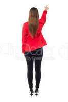 Woman pointing towards to the wall