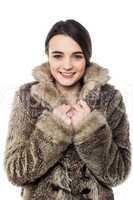 Stylish young girl in fur jacket