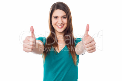 Lovely female gesturing double thumbs up