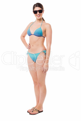 Sexy bikini model, full length studio shot