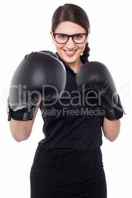 Pretty young boxer woman in action