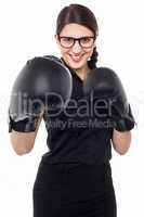Pretty young boxer woman in action