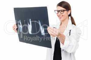 Young doctor examining thumb x-ray report